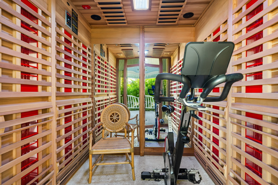 Infrared sauna cabin with a training bike inside the clinic